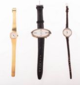 A group of three dress watches, including a vintage Bovenit mechanical wind wristwatch,
