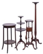 A mahogany circular torchere stand, on a