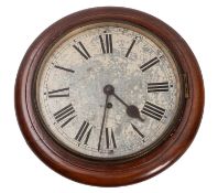 An Edwardian round oak wall clock having