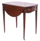 A Regency mahogany and inlaid oval Pembr