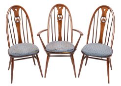 An Ercol dark elm extending dining table