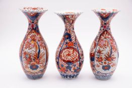 A pair of Japanese Imari baluster vases