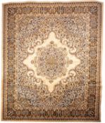 A machine made carpet of Persian design,