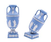A pair of Wedgwood blue and white jasper ware two-handled vases,