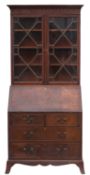 A 1920's mahogany bureau bookcase, in th