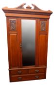 A walnut wardrobe, early 20th century;