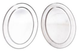 Two modern oval stainless steel oval mea