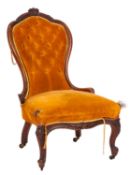 A lady's Victorian carved walnut chair,