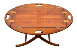 A butlers yew-wood oval drop flap tray,
