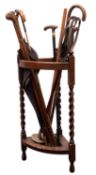 An Edwardian oak corner umbrella stand,
