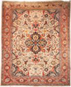 A Tabriz carpet, the ivory field with a