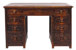 A late 19th Century carved dark oak knee