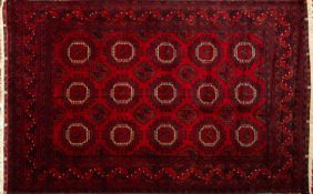 A Turkoman rug, the wine field with thre
