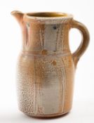*Michael Casson [1925 - 2003] a stoneware Puisaye jug under orange salt glaze,