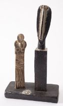 *John Maltby [1936 - 2020] stoneware group, A female figure admiring a sculpture,