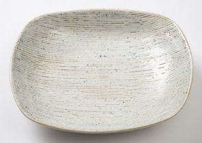 *Dame Lucie Rie DBE [1902-1995] a stoneware dish, of rounded rectangular form the white,
