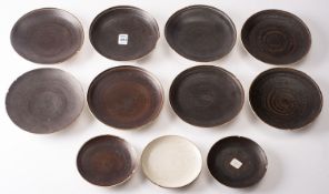 *Dame Lucie Rie DBE [1902-1995] a group of stoneware tea wares decorated in manganese and off white