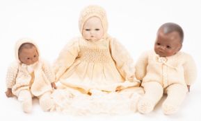 A 20th Century porcelain bisque head doll.