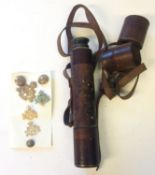 A leather cased four draw brass telescope, together with a small collection of badges etc.