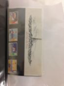 An album of stamps, postcards, beer mats and other ephemera.