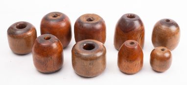 A group of nine various lignum chogs, various sizes.