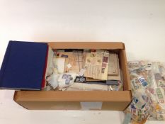 Box of stamps in packets on pages, covers, albums etc.