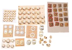 A collection of various regimental buttons and badges including Royal Engineers etc. .