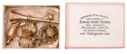 A late 19th/early 20th century yellow metal whistle of small size,