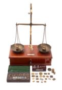 A set of mahogany and brass travelling balance scales, maker De Grave, Shot & Co Ltd, London,
