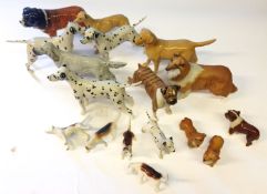 A collection of Beswick dogs. Including hounds, dalmations and corgis etc, in a range of sizes.