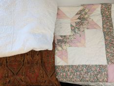 A 20th Century patchwork quilt.