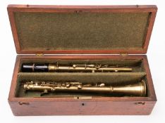 A Henry Distin & Co, Newport brass clarinet.