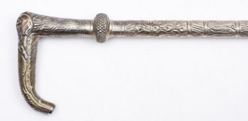 An Indian white metal walking cane,