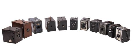 Four Boxed Brownie cameras.