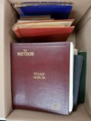 A box of eighteen stamp albums and stock books.