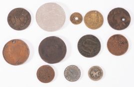 A small group of world coins including Dury Lane Theatre 1888, The Armada Token etc.