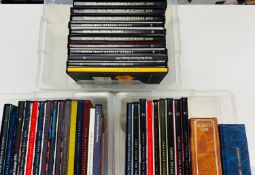 Thirty-six Royal Mail commemorative year books with stamps, plus two cigarette card albums.