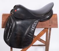 A Paul Jones 18 inch black leather saddle.