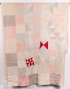 A 20th Century patchwork quilt.