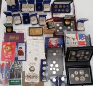 Collection of forty-seven coin sets or single cased coins from the UK including proofs.