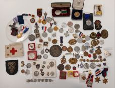 A collection of various medals,medallions and badges,