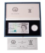 A 1990 Royal Mint proof £5 coin and note set. Boxed.