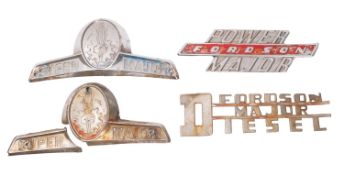 A collection of Ford and Fordson bonnet badges. Including Super Major and Power Major etc.