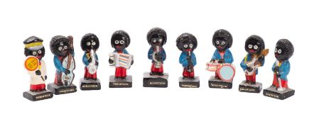 A group of nine Robertson Jam advertising figures,