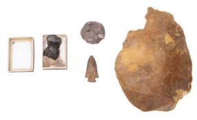 A flint axe head. Together with three arrow heads etc.