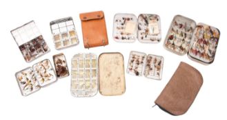 A collection of various trout flies. In eight metal tins and two brown leather wallets.