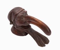 An early 20th Century Swiss carved oak nutcracker. With stamp to base, 10cm high.