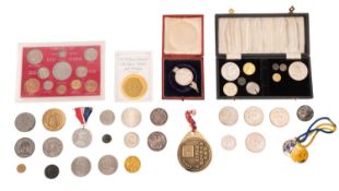 A collection of various coins and medallions.