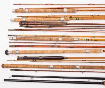 A group of eight various fishing rods, comprising and Army & Navy 9ft three piece rod,