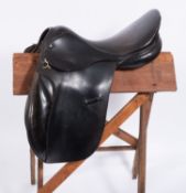 A Lovett & Ricketts 18 inch black leather saddle.
